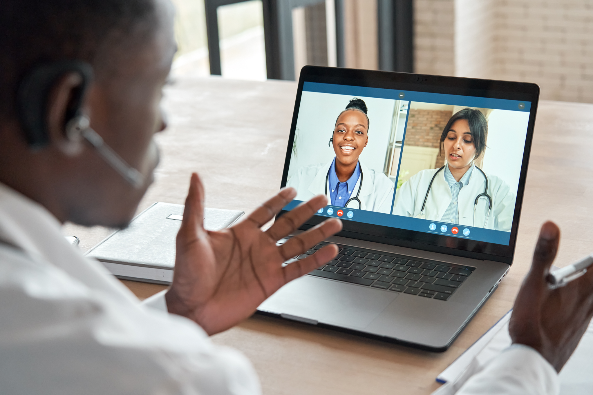 A man video conferencing with doctors